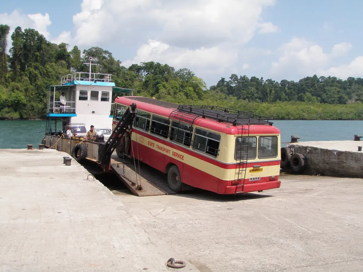 Bus driving onto a car ferry at Baratang