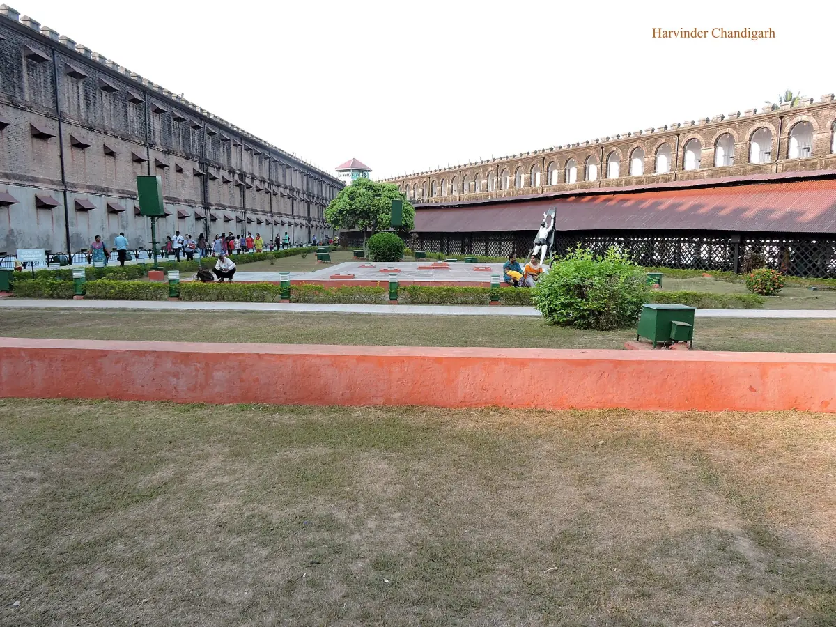 Long brick cell wing of the Cellular Jail seen across the lawn
