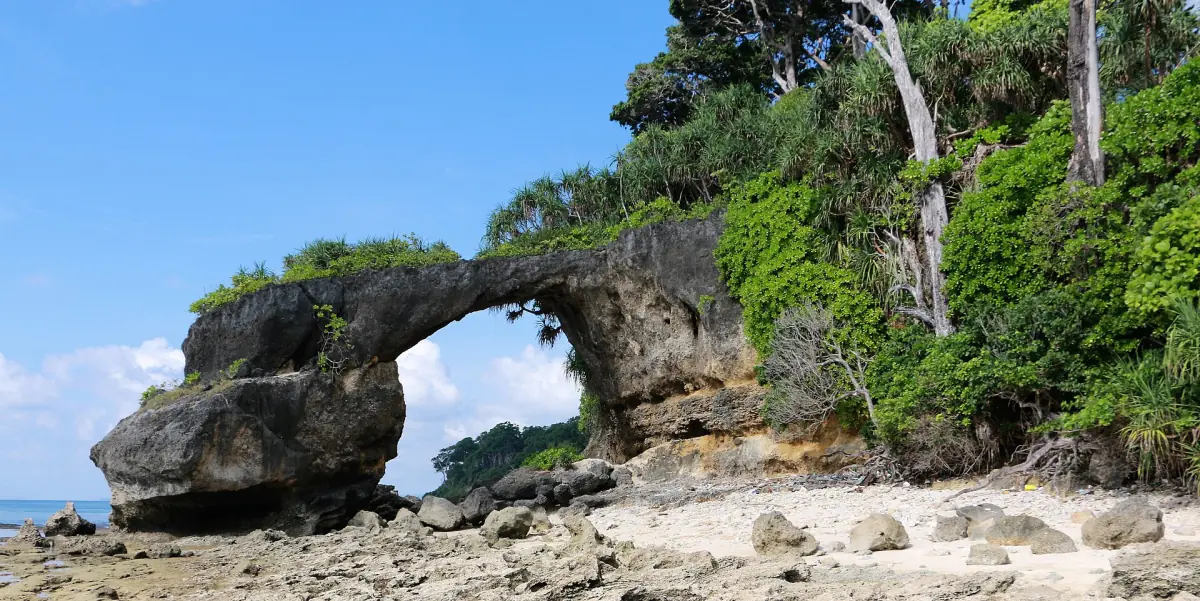 Natural rock arch over the sea on the coast of Neil Island