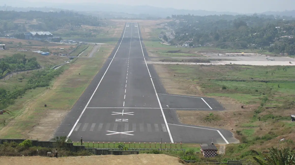 Runway of Port Blair airport seen from above surrounded by greenery